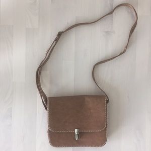 Brown handbag with brushed metal clasp